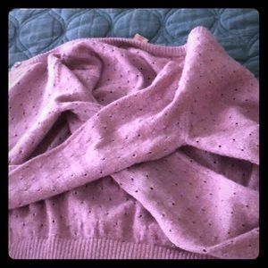 A pink sweater